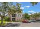 Condo with beautiful landscaping, dedicated parking spots, and trees to provide shade at 8168 Boat Hook Loop # 201/718, Windermere, FL 34786