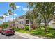 Condo with palm trees and well-kept landscaping at 8168 Boat Hook Loop # 201/718, Windermere, FL 34786