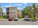 Exterior of a condominium complex with well-kept landscaping, reserved parking and community amenities at 8168 Boat Hook Loop # 201/718, Windermere, FL 34786