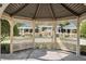 View from inside a gazebo looking out at manicured lawns and other gazebos at 8168 Boat Hook Loop # 201/718, Windermere, FL 34786
