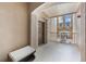 Inviting hallway with neutral walls, arched doorway, and a view of the outdoors at 8168 Boat Hook Loop # 201/718, Windermere, FL 34786