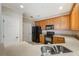 Bright kitchen featuring stainless sink, granite countertops and wood cabinets at 8168 Boat Hook Loop # 201/718, Windermere, FL 34786