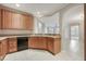 Bright kitchen featuring granite countertops and wood cabinets at 8168 Boat Hook Loop # 201/718, Windermere, FL 34786