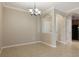 Neutral living space with tile flooring and view to the kitchen at 8168 Boat Hook Loop # 201/718, Windermere, FL 34786