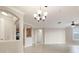 Bright living space with tile flooring, archways, and views into the kitchen at 8168 Boat Hook Loop # 201/718, Windermere, FL 34786