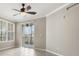 Bright living space with large windows and access to an outdoor balcony at 8168 Boat Hook Loop # 201/718, Windermere, FL 34786