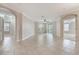 Spacious living area featuring tiled floors and a ceiling fan for comfort at 8168 Boat Hook Loop # 201/718, Windermere, FL 34786