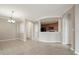 Open living space with kitchen, dining room, and laundry access at 8168 Boat Hook Loop # 201/718, Windermere, FL 34786