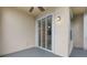 Covered patio featuring sliding glass doors and a ceiling fan at 8168 Boat Hook Loop # 201/718, Windermere, FL 34786