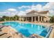 A serene pool offering plenty of lounge seating and mature landscaping at 8168 Boat Hook Loop # 201/718, Windermere, FL 34786