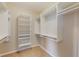 Spacious walk-in closet with built-in shelving and hanging rods for optimal organization at 8168 Boat Hook Loop # 201/718, Windermere, FL 34786