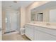 Elegant bathroom with a glass-door shower and double sink vanity at 865 Citrus Reserve Blvd, Davenport, FL 33837