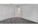 Empty bedroom featuring neutral carpet and a closet at 865 Citrus Reserve Blvd, Davenport, FL 33837