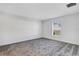 Well-lit bedroom featuring plush carpet and a window with blinds at 865 Citrus Reserve Blvd, Davenport, FL 33837
