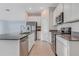 Bright kitchen featuring stainless steel appliances and a center island with a sink at 865 Citrus Reserve Blvd, Davenport, FL 33837