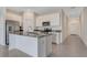 Modern kitchen featuring stainless steel appliances and a center island at 865 Citrus Reserve Blvd, Davenport, FL 33837
