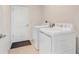 Convenient laundry room featuring new appliances and tile flooring at 865 Citrus Reserve Blvd, Davenport, FL 33837