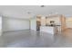 Spacious living room with tile flooring, seamlessly connected to the kitchen at 865 Citrus Reserve Blvd, Davenport, FL 33837