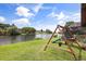 A playset is placed in the large backyard for playing activities at 930 Chickadee Dr, Port Orange, FL 32127