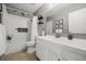 Clean and bright bathroom featuring white vanity, tub and tiled shower at 930 Chickadee Dr, Port Orange, FL 32127