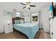 Cozy bedroom with natural light, a ceiling fan, and calming blue accents at 930 Chickadee Dr, Port Orange, FL 32127