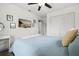 Serene bedroom featuring a ceiling fan and a soft color palette for a relaxing retreat at 930 Chickadee Dr, Port Orange, FL 32127