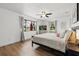 Tranquil bedroom with wood floors and large windows offering outdoor views at 930 Chickadee Dr, Port Orange, FL 32127