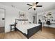 Comfortable bedroom with wood flooring, ample natural light, and a built-in desk area at 930 Chickadee Dr, Port Orange, FL 32127
