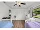 Spacious bedroom featuring twin beds, a closet, and ample natural light at 930 Chickadee Dr, Port Orange, FL 32127