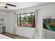 Bedroom boasts views of a beautiful screened-in lanai and waterfront at 930 Chickadee Dr, Port Orange, FL 32127