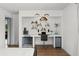 Bright home office with built-in desk, shelves, and a cozy 'dog cave' underneath at 930 Chickadee Dr, Port Orange, FL 32127