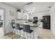 Bright kitchen with white cabinetry, granite countertops, stainless steel appliances and a breakfast bar at 930 Chickadee Dr, Port Orange, FL 32127