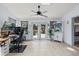 Bright living space with tile flooring, patio access, and a view of the pool at 930 Chickadee Dr, Port Orange, FL 32127