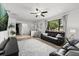 Spacious living room with tile floors, comfortable seating, and a large window offering natural light at 930 Chickadee Dr, Port Orange, FL 32127