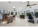 Spacious living room with a built-in bar, skylights, and tile flooring at 930 Chickadee Dr, Port Orange, FL 32127