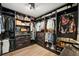 Spacious walk-in closet with custom shelving, drawers, and ample storage space at 930 Chickadee Dr, Port Orange, FL 32127
