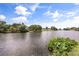 A scenic view of the water with surrounding homes showcases a relaxing and picturesque environment at 930 Chickadee Dr, Port Orange, FL 32127