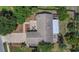 Overhead view showcasing the home's layout, backyard patio, and roof, highlighting its well-maintained condition at 9319 Woodbreeze Blvd, Windermere, FL 34786