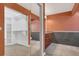 Bathroom featuring modern cabinetry, ample storage, and a walk-in closet at 9319 Woodbreeze Blvd, Windermere, FL 34786