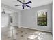 Light and airy bedroom featuring tile floors, natural light, and large closet at 9319 Woodbreeze Blvd, Windermere, FL 34786