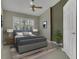 Calm bedroom with soft bedding, window shutters, and warm lighting at 9319 Woodbreeze Blvd, Windermere, FL 34786