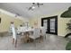 Bright dining area with modern table setting, elegant decor, and tile floors at 9319 Woodbreeze Blvd, Windermere, FL 34786