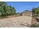 Paver driveway that leads up to a light colored home with a two car garage at 9319 Woodbreeze Blvd, Windermere, FL 34786