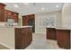 Traditional-style kitchen featuring warm cabinetry, stainless appliances, and plenty of counter space at 9319 Woodbreeze Blvd, Windermere, FL 34786
