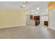 Open-concept living area flows into the kitchen, with dark cabinetry and tiled flooring at 9319 Woodbreeze Blvd, Windermere, FL 34786