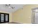 Vaulted ceiling living area with tile floor, french doors, and lots of light at 9319 Woodbreeze Blvd, Windermere, FL 34786