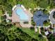 Aerial view of the community pool, clubhouse and landscaped grounds at 934 Rock Harbor Ave, Orlando, FL 32828