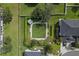 Aerial view of a neighborhood park with manicured lawns, benches, and shaded gazebo at 934 Rock Harbor Ave, Orlando, FL 32828