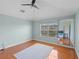 Spacious bedroom with hardwood floors, ceiling fan, and a window with a lot of natural light at 934 Rock Harbor Ave, Orlando, FL 32828