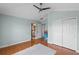 Bedroom view featuring hardwood floors, walk in closet, and access to Primary bathroom at 934 Rock Harbor Ave, Orlando, FL 32828